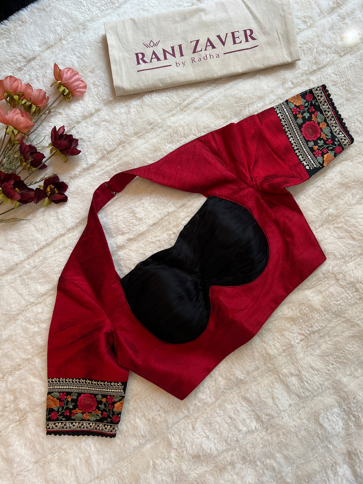 Elegant black organza saree complemented by designer blouse