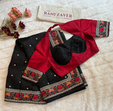 Designer blouse paired with black pure organza saree